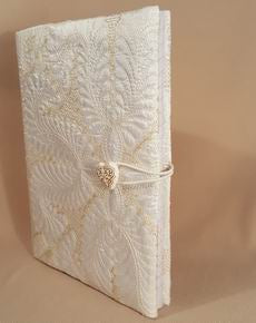 HOW TO MAKE: a Quilted Book Cover at astitchahalf.net