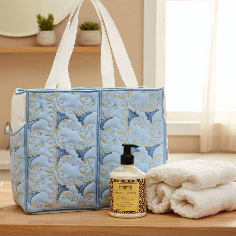 Blue patterned tote bag with a bottle of @home product on a beige surface