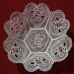 Decorative lace doily with intricate patterns on a red background