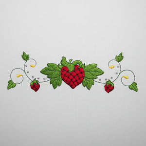 Embroidered design of a heart with leaves and berries on a white background