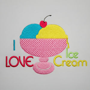 Embroidered design of an ice cream cone with colorful text on a gray background