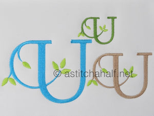 Embroidered letter 'U' with green leaves on a white background, featuring three different color options.
