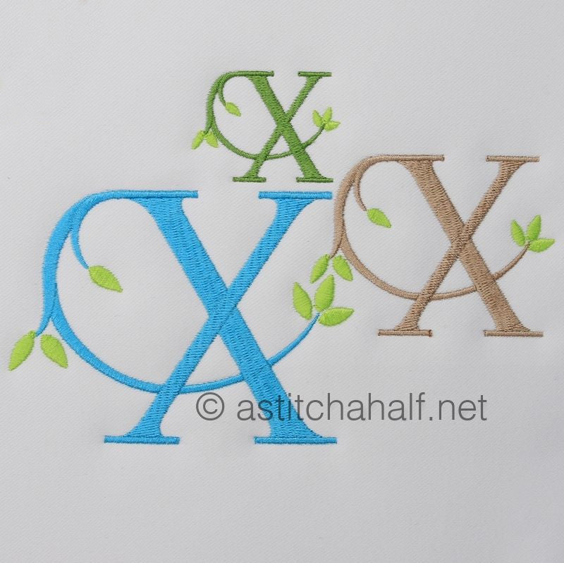 Embroidered letters 'OX' in various colors on a light gray background with 'astitchahalf.net' branding.