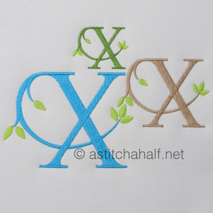 Embroidered letters 'OX' in various colors on a light gray background with 'astitchahalf.net' branding.