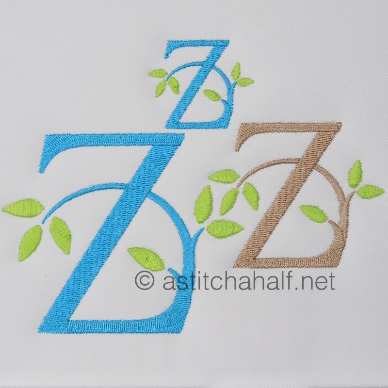 Embroidered initials 'ZS' with leaves on a white background, featuring 'astitchahalf.net'.
