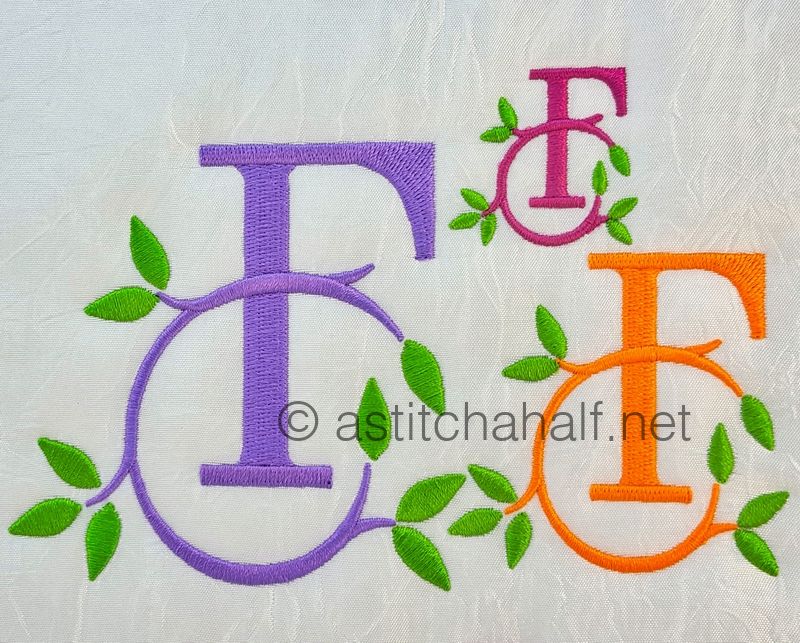 Embroidered monograms with leaves on a white background