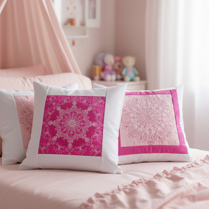 Decorative pillows with pink and white patterns on a bed in a bedroom setting.