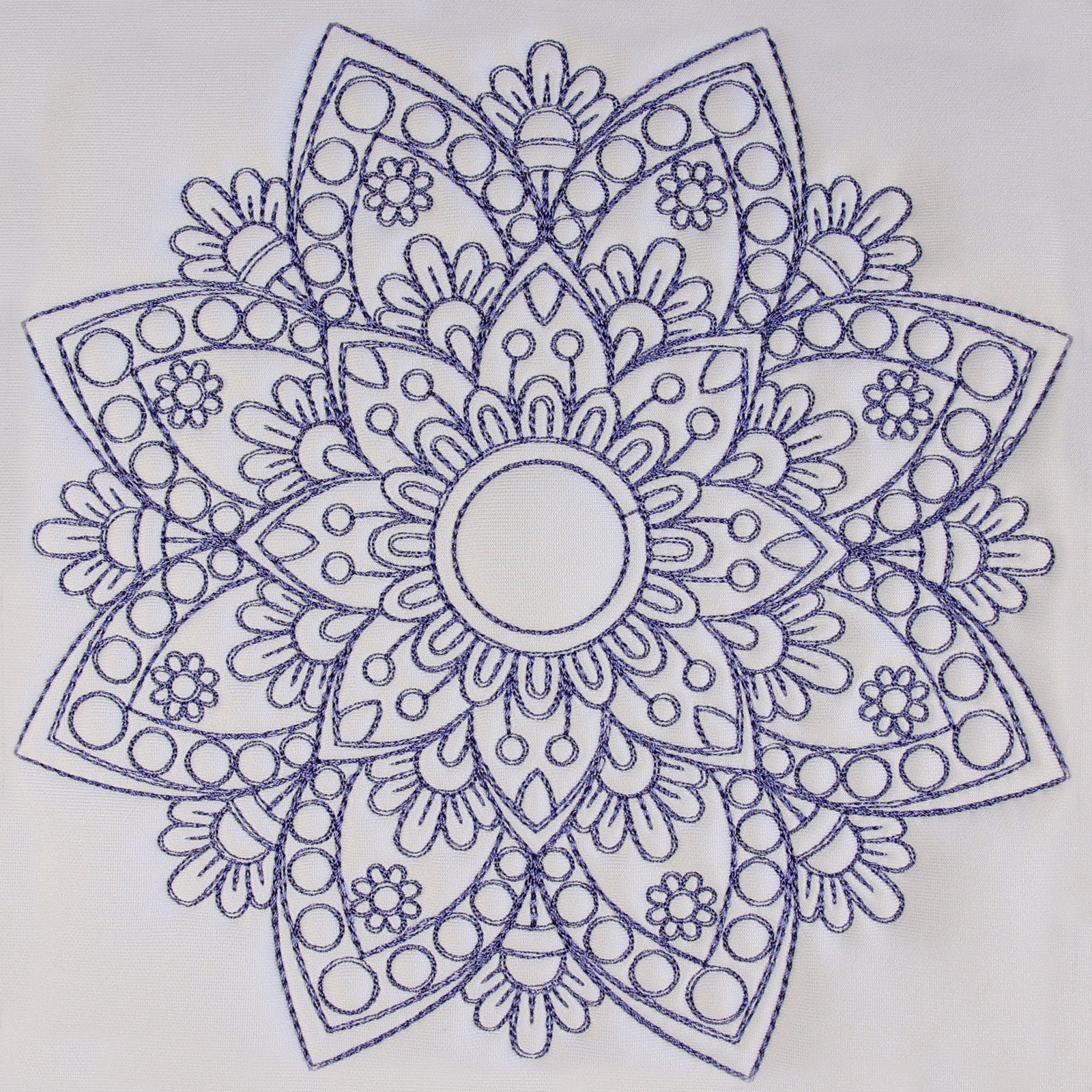 Decorative table runner with mandala patterns on a white table