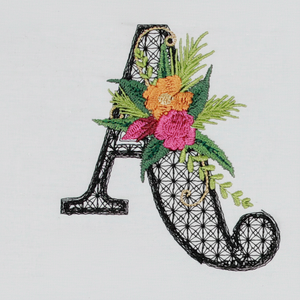 Embroidered letter 'A' with floral designs on a white background