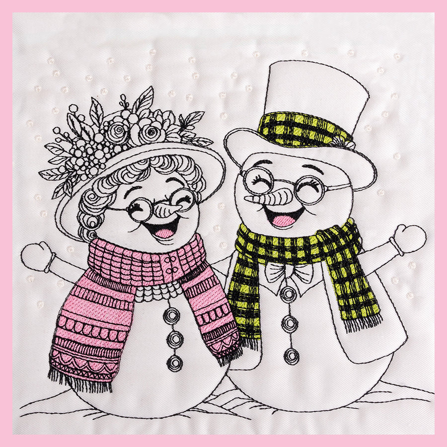 Snowman and snow woman pair with bright smiles, in the snow.