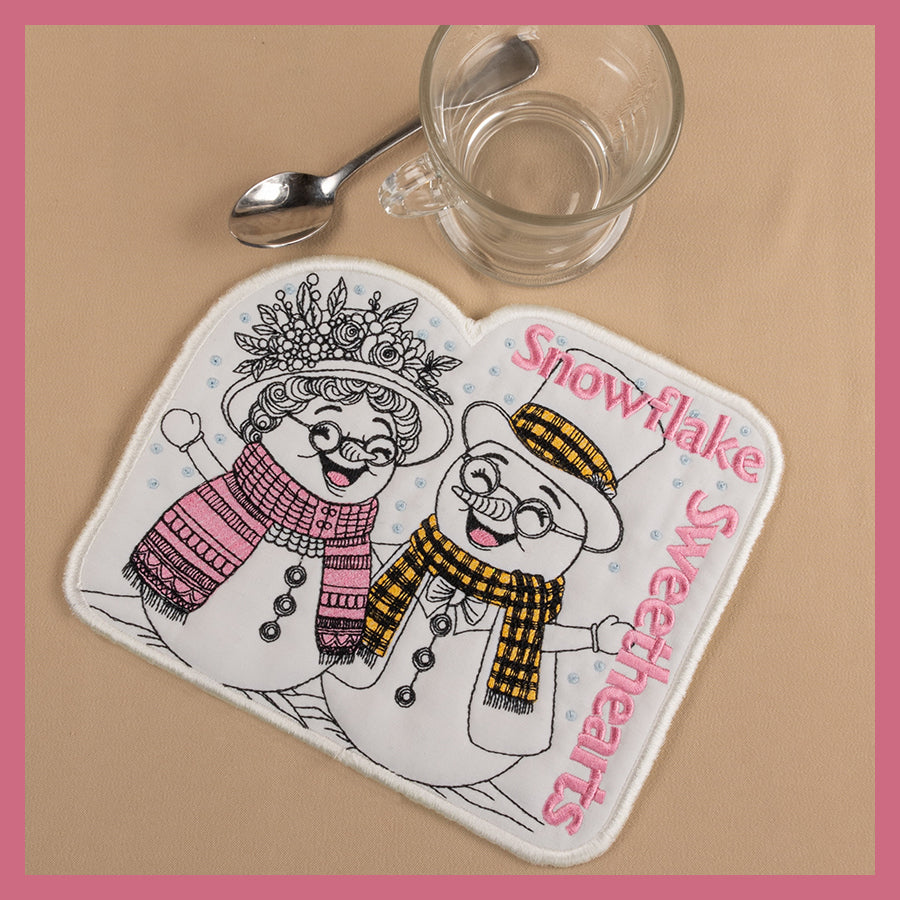 Laughing and smiling coasters and mug rugs snowman and snowwoman in yellow and pink with bright scarves. 