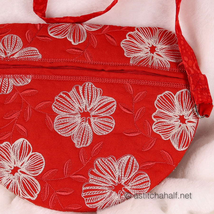 Red bag with white floral pattern on a white background