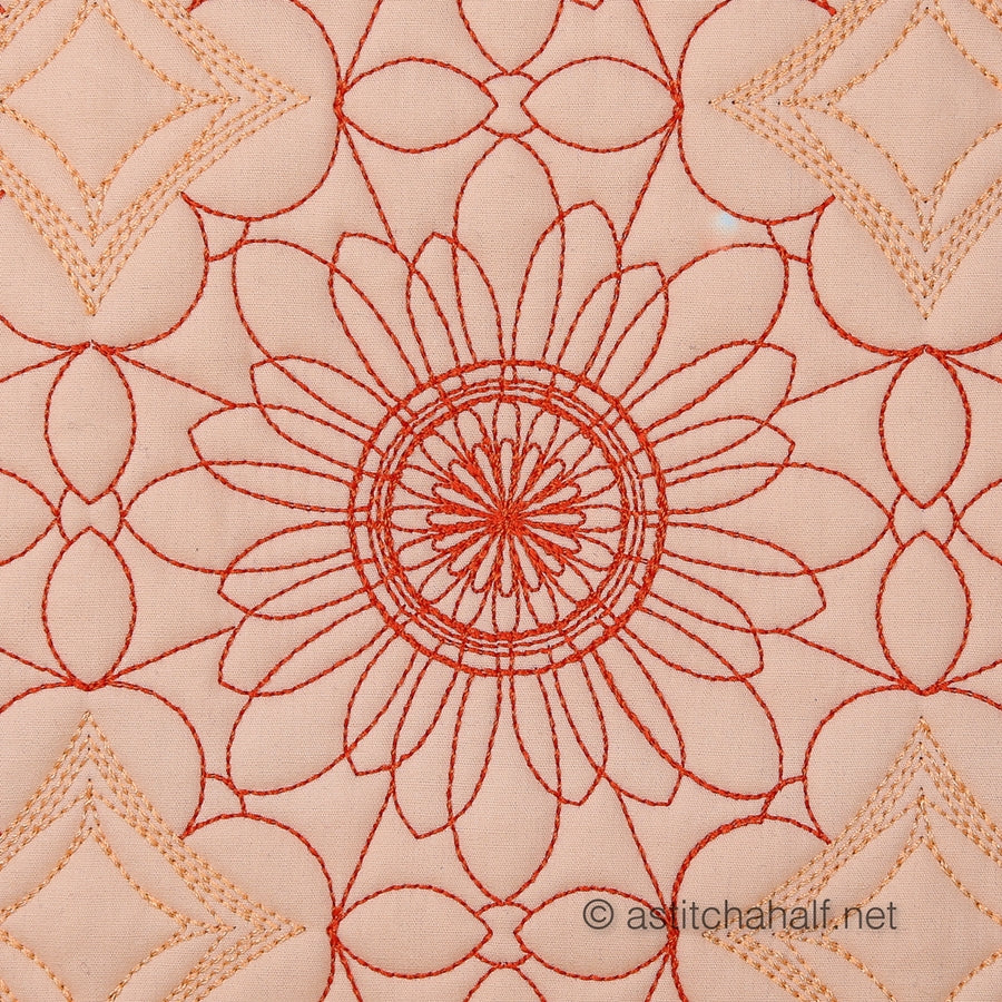 Close-up of red floral embroidery on a beige fabric background