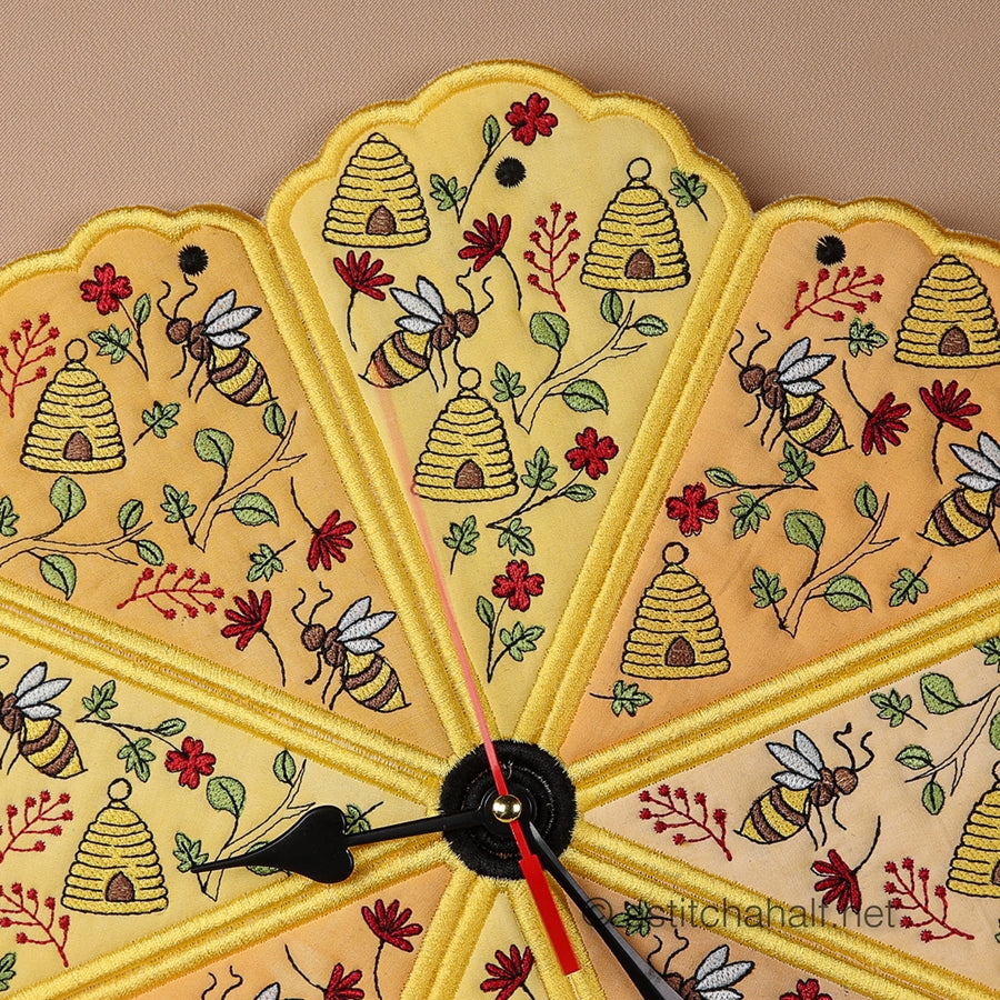 Decorative wall clock with bee and honeycomb design on a beige background