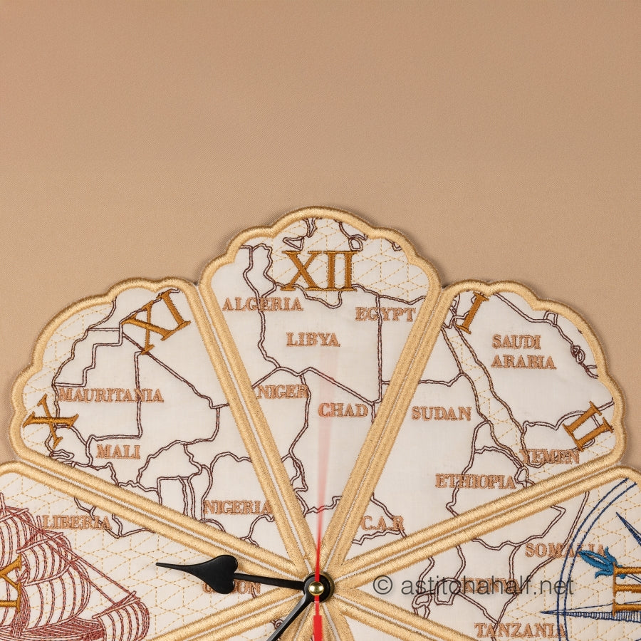 Decorative wall clock with map design and ship illustrations on a beige background