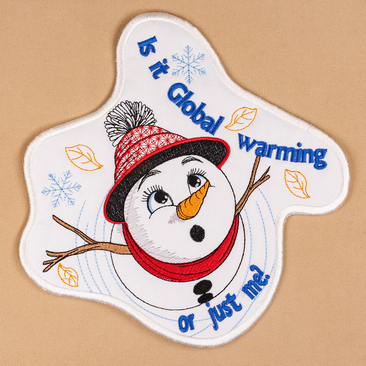 Patch with a snowman design and text on a beige background