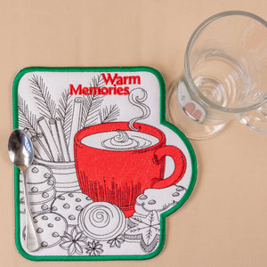 Coaster with red coffee cup design and 'Warm Memories' text on a beige background