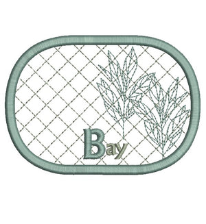Embroidered patch with leaf design and the letter 'B' on a white background
