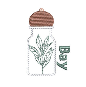 Bay leaf in a glass bottle with a brown lid on a white background