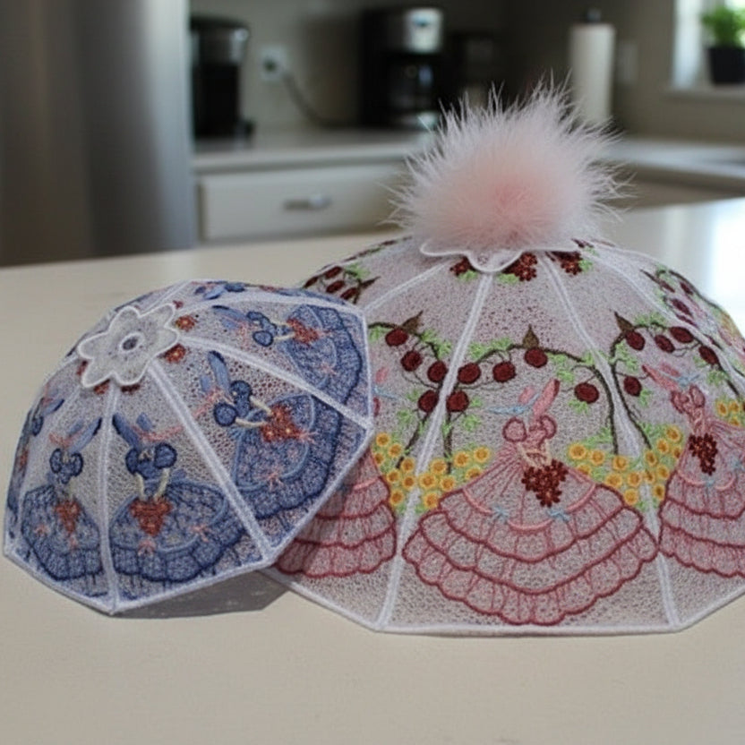 Decorative umbrella over a plate of cupcakes with balloons and party decorations in the background